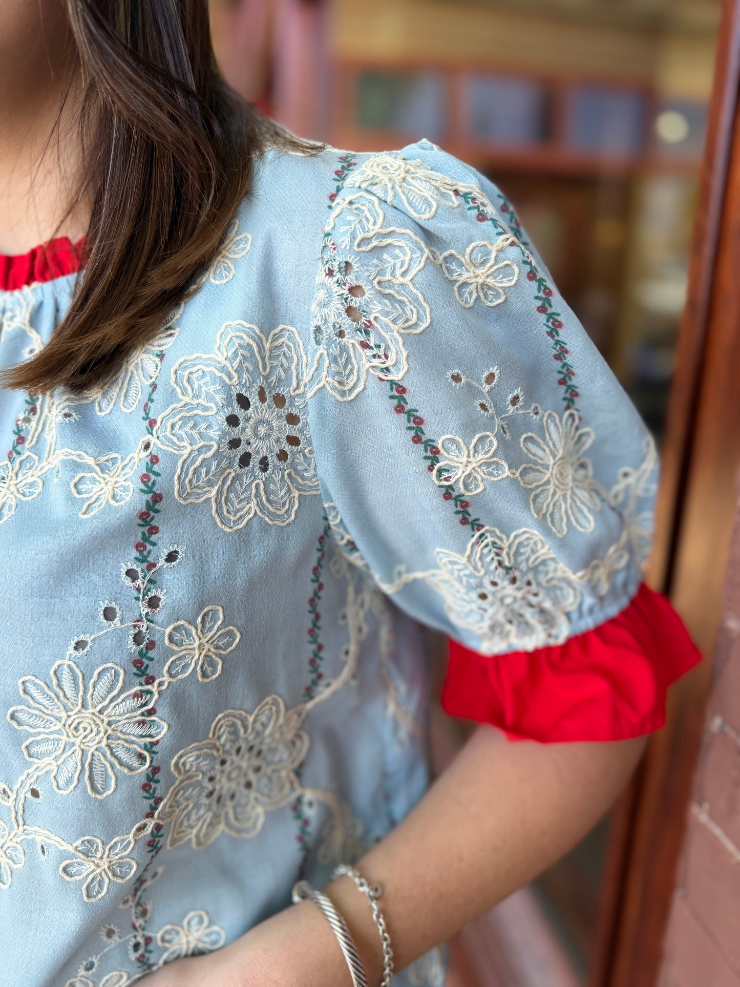 Red eyelet and blue top