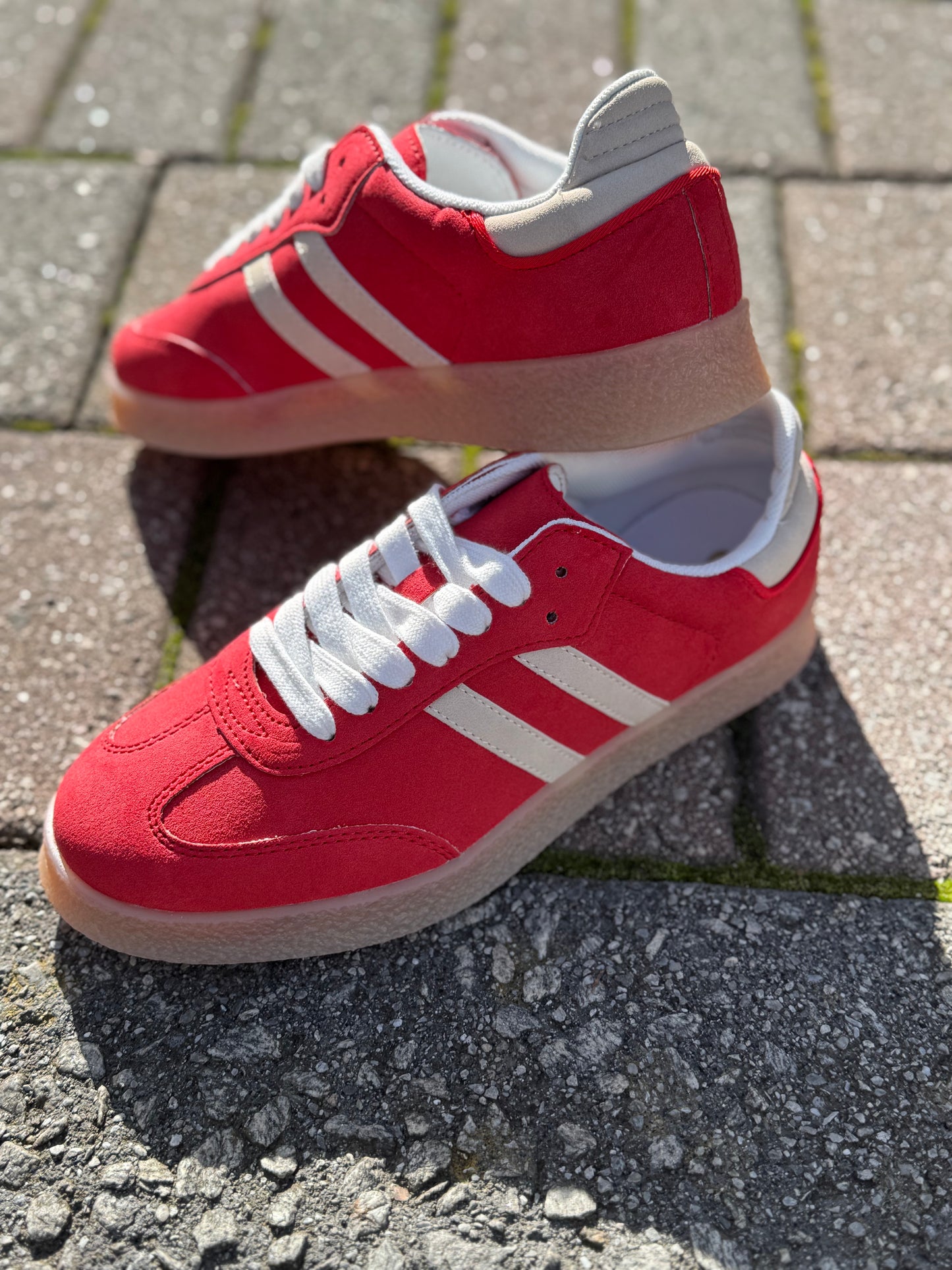 Red double stripe sneakers