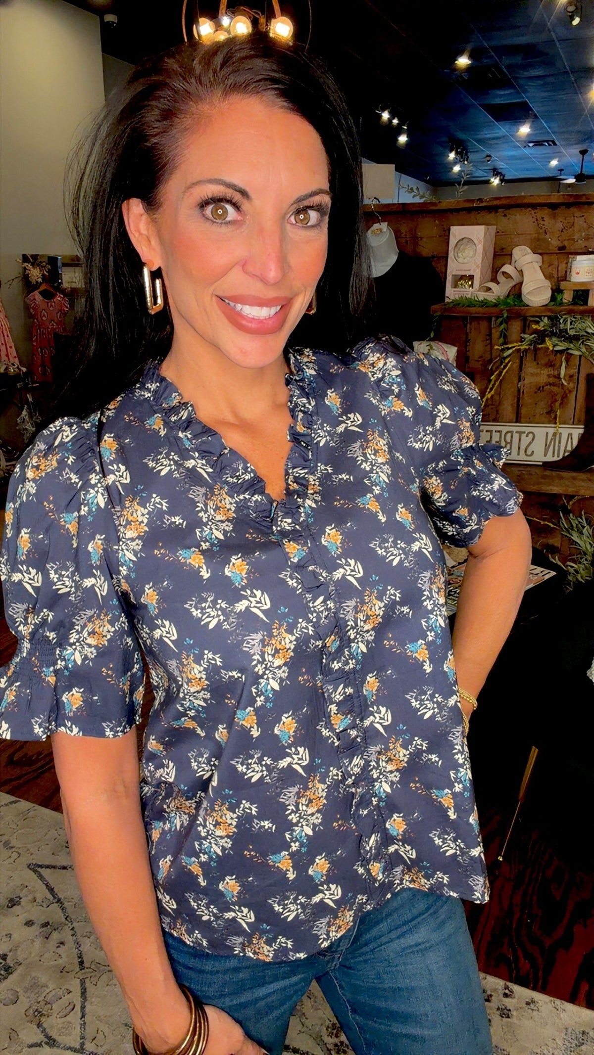 Navy print ruffle neck top