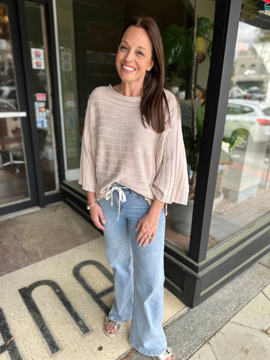 Exposed seam dolman top